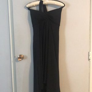 Black dress with a scalloped hem